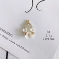 Detailed macro view of 21x17mm gold floral pendant with pearl and shell flower accents - 3#