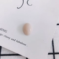 Close-up of smooth oval pink resin stone bead for DIY shoe charms and phone case art - Pale Pink (15#)