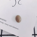 Close-up of a smooth oval khaki resin cabochon bead for DIY jewelry and phone case crafts - Khaki (18#)