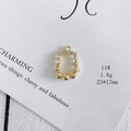 Detailed macro view of 23x17mm gold alloy rabbit head pendant with faux pearls and rhinestones - Size 11