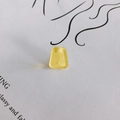 Macro detail of trapezoid yellow acrylic pendant with gold glitter and pre-drilled hole - Warm Yellow (1#)