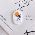 Detail of an oval acrylic pendant with a sun and blue leaf motif for DIY jewelry - Orange Sun Blue Plant (2#)