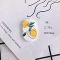Detail view of 40x24mm acrylic oval pendant with yellow lemon and green leaf pattern - Fresh Lemon Green Leaf (5#)