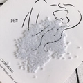 Macro detail of 2mm cream white glass beads scattered on artistic line art card - 450g Pack (Approx. 57600 Pcs) / 16#