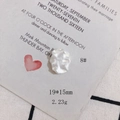 Macro detail of 19x15mm baroque style cream white shell-like resin accessory charm - Baroque Freeform Style (8#)