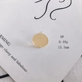 Detail of a 15.5mm light yellow acrylic round stud earring on a white display card - 4# Pale Yellow Semi-transparent