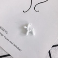 Matte white balloon dog charm for DIY jewelry making on a stylish decorative background - Matte White