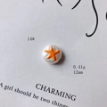 Dettaglio di una perla in acrilico da 12mm con motivo a stella e peso 0.41g - Stile Motivo Stella Marina Tondo (14#)