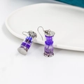 Silver-plated earrings featuring purple dried flowers in transparent glass drift bottles - Purple