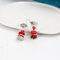 Detailed macro view of drifting bottle earrings with red dried flowers and silver hooks - Red