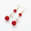 Detail of cherry-style red rhinestone drop earrings with white pearls and gold hooks - Red Rhinestone Ball + White Pearl
