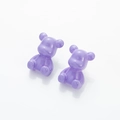 Macro view of purple resin teddy bear earrings with a smooth translucent finish - Purple