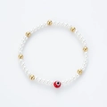 Pulsera de perlas hecha a mano con detalles dorados y dije de ojo turco rojo para parejas - Mal de Ojo