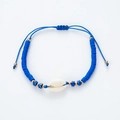 Detail of handmade bohemian blue Heishi bead bracelet with natural shell and adjustable cord - Blue