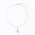 Macro detail of silver drifting bottle pendant with pink flowers and blue sequins - Stainless Steel Blue