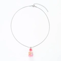 Detailed macro of a silver snake chain necklace with a pink sand glass bottle pendant - Stainless Steel Red