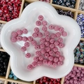 Perle boule disco strass rose pour bijoux DIY présentée sur une assiette en étoile - Rond / 10mm / Rose