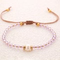 Handgefertigtes Perlenarmband mit lila Kristallperlen und weißer Süßwasserperle - Hellviolett