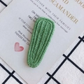 Detail of a handmade grass green knitted waterdrop hair clip with clear woven texture - Grass Green