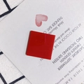 Flat lay of red square resin accessory with glossy finish on aesthetic display card - Bright Red (7#)
