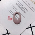 Detailed view of dusty pink oval resin pendant with glossy finish on a white card - Grey-Pink (9#)