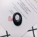 Close-up of a polished black oval resin pendant accessory for DIY earring making - Black (11#)