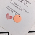 Close-up of matte orange-pink round alloy pendant with hole for DIY jewelry making - Peach Pink (7)