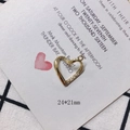 Detail of a 24x21mm golden hollow heart pendant with textured inner finish for DIY jewelry - Gold Hollow Double Circle Heart Pendant (17)