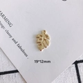Detailed view of a golden monstera leaf pendant for DIY jewelry, measuring 19 by 12mm - Gold Monstera Leaf Pendant (21)