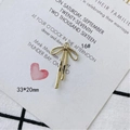 Vista de detalle de colgante de lazo dorado en aleación para joyas DIY 33x20mm - Estilo de Lazo Pulido Grande (16#)
