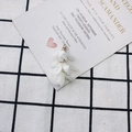 Detailed view of handmade white tassel flower pendants with gold metal caps for DIY jewelry - White Style (2#)
