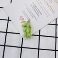 Detailed view of light green fabric leaf tassel with embossed gold metal cap for DIY jewelry - Light Green Style (3#)