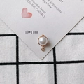 Close-up of 19x11mm pearl pendant with gold wire wrap on decorative background - Classic Hook Round Bead Style (6#)