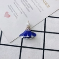 Close-up of DIY floral fabric tassel pendant with white imitation pearls and gold cap - Dark Blue and White Style (10#)
