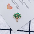 Macro detail of leaf-shaped gold alloy pendant with green marquise stones and micro-diamonds - Green (1#)
