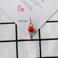 Detail of a 40x10mm gold spiral pendant with a red bead for DIY jewelry making - Red Shuttle Art Style (13#)