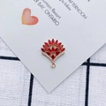 Macro shot of fan-shaped gold pendant with red marquise gems and white zircons - Red (3#)
