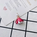 Close-up of red and white fabric flower pendant with a pearl and golden metal cap - Dark Red and White Spliced Style (17#)
