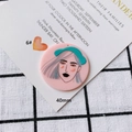 Detailed view of 40mm pink acrylic pendant featuring a minimalist artistic portrait - Minimalist Portrait Illustration Disc (6#)