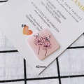 Detail view of 42mm pink acrylic floral pendant with black line art on wedding card - Pink Floral Acrylic Square (8#)