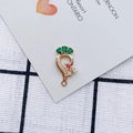 Macro shot of gold alloy earring pendant with emerald green and red zircon stones - Green Gemstone Peacock Style (3#)