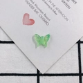 Detail of translucent green butterfly resin charm with fine textured wings for DIY jewelry - Emerald Green (1)