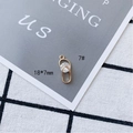 Detail view of a 18x7mm gold plated oval pendant with clear faceted cubic zirconia inlay - Oval Rhinestone Style (7#)