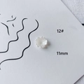 Detail showing 11mm pearl white flower acrylic bead with petal texture and center hole - Pearlescent Radiating Flower (12#)
