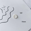 Macro shot of 11mm white acrylic flower bead for DIY jewelry making with central hole - Ten-petal Radiating Flower (14#)