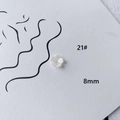 Macro shot of 8mm white acrylic flower beads for DIY jewelry making and nail art - Mini Five-petal Flower (21#)