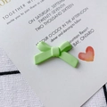 Close-up of light green matte alloy bow earring accessory for DIY jewelry making - Light Green