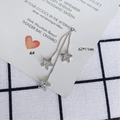 Detailed view of silver star drop earrings with inlaid crystals on long snake chain - Silver Star Tassel Style (4#)