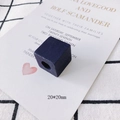 Detail view of a 20mm dark blue square wooden bead with a hole for DIY jewelry making - Dark Blue Cube (20x20mm)