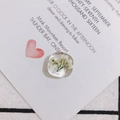 Macro shot of faceted resin charm with dried white baby's breath flowers for DIY jewelry - White Gypsophila Style (2#)